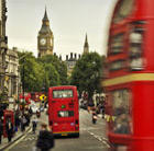 A view of London with Big Ben and red buses, which can be visited with a cheap flight to London with Flight Centre.