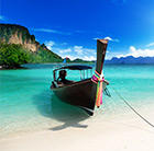 A beach with white sand and clear, blue water can be enjoyed in Thailand, which can be visited via a flight from Flight Centre.