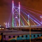 A view of the Nelson Mandela bridge in Johannesburg at night that can be viewed via a cheap flight to Johannesburg with Flight Centre.