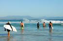 Surfers aiming for the next wave
