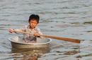 Kid Paddling, Tonle Lake Floating Village | By Flight Centre's Ken Ng