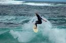 Surfer Riding The Waves